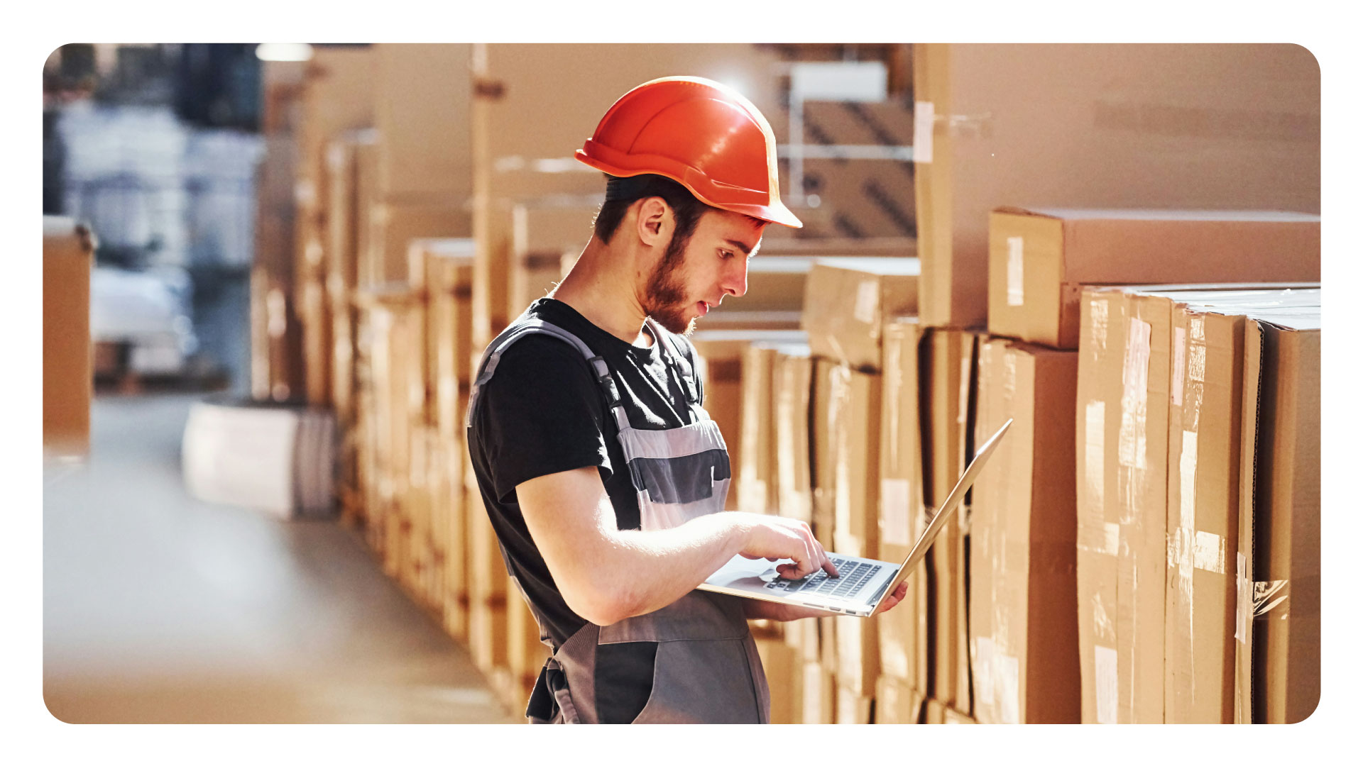 Image showing person tracking inventory in a warehouse.